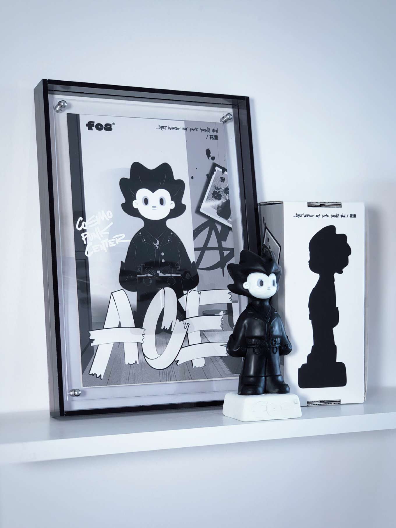 Ace character figure displayed with printed matter