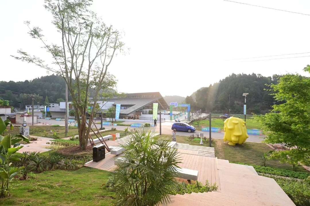 Character sculpture in a rural community landscape