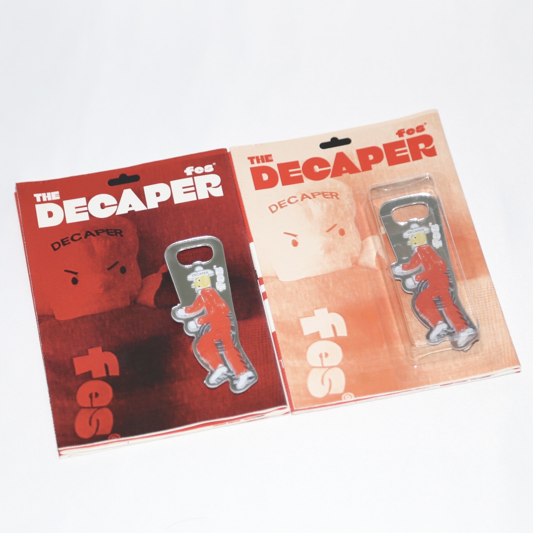 Two Decaper books presented with mirrored acrylic objects