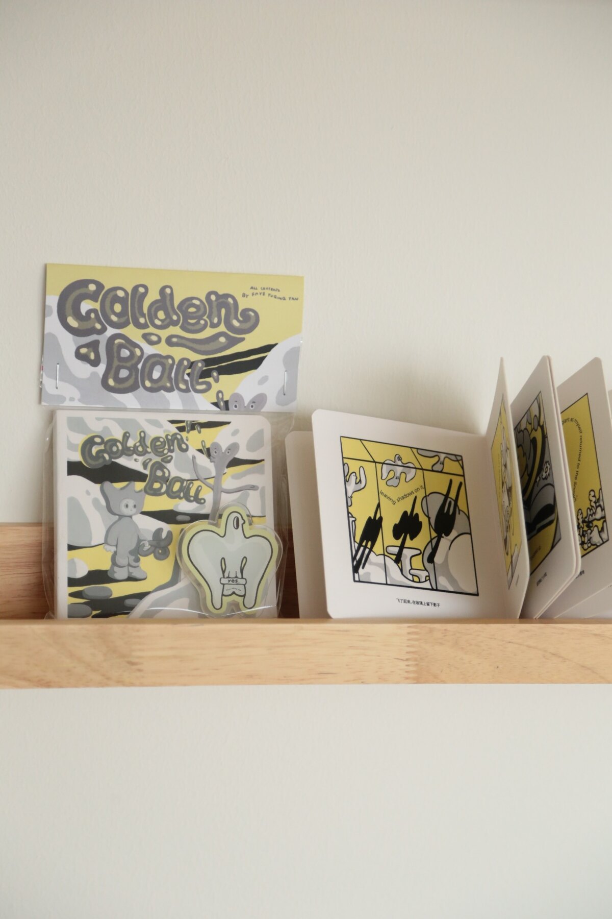 Golden Ball packaged edition beside an open display copy